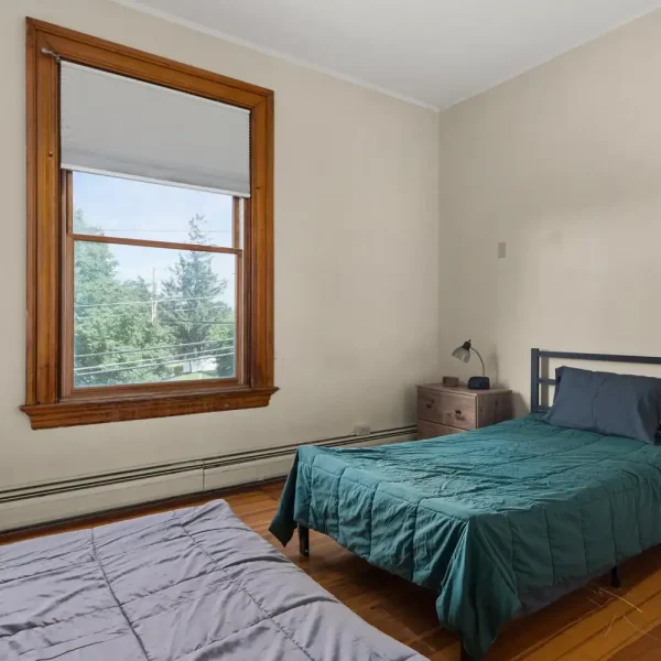 Comfortable bedroom in transitional living facility.