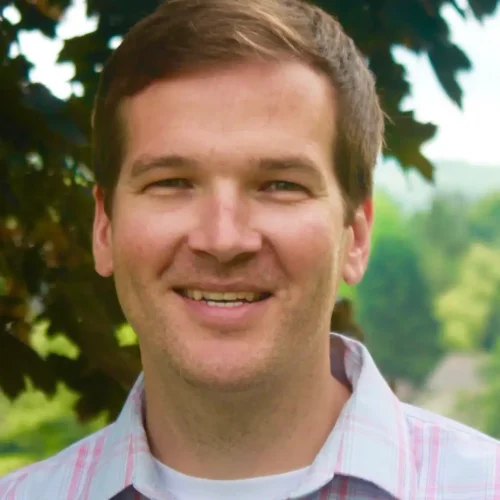 Patrick Brown smiling outdoors at Confluence Behavioral Health.